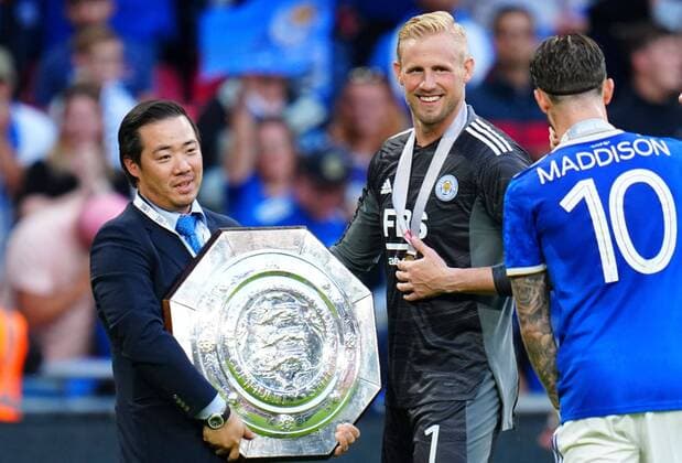 Mandatory Credit: Photo by Javier Garcia Shutterstock (12250603al) Aiyawatt Top Srivaddhanaprabha celebrates with the Community Shield alongside Leicester City goalkeeper Kasper Schmeichel Leicester City v Manchester City, The FA Community Shield, Football, Wembley Stadium, London, UK - 7 August 2021 EDITORIAL USE ONLY No use with unauthorised audio, video, data, fixture lists, club league logos or live services. Online in-match use limited to 120 images, no video emulation. No use in betting, games or single club league player publications. Leicester City v Manchester City, The FA Community Shield, Football, Wembley Stadium, London, UK - 7 August 2021 EDITORIAL USE ONLY No use with unauthorised audio, video, data, fixture lists, club league logos or live services. Online in-match use limited to 120 images, no video emulation. No use in betting, games or single club league player publications.  Copyright: xJavierxGarcia Shutterstockx 12250603al