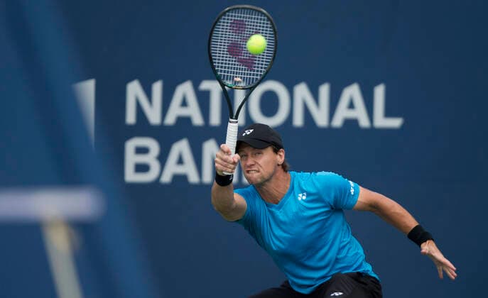 (210808) -- TORONTO, Aug. 8, 2021 -- Ricardas Berankis of Lithuania returns the ball against Norbert Gombos of Slovakia during the first round of men s qualifying singles match at the 2021 National Bank Open in Toronto, Canada, on Aug. 7, 2021. (Photo by Xinhua) (SP)CANADA-TORONTO-TENNIS-NATIONAL BANK OPEN-MEN S SINGLES-QUALIFYING ZouxZheng 