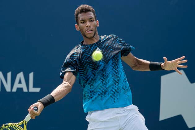 August 9, 2021, Toronto, on, Canada: Canada s Felix Auger-Aliassime returns the ball during Men s National Bank Open doubles tennis action against Russia s Karen Khachanov and Andrey Rublev, in Toronto on Monday, Aug., 9, 2021. Canada News - August 9, 2021  - ZUMAc35_ 20210809_zaf_c35_070 Copyright: xChristopherxKatsarovx