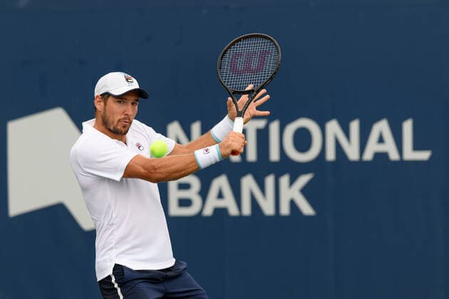 TORONTO, ON - AUGUST 10: Dusan Lajovic (SRB) returns the ball during his National Bank Open tennis tournament first round game on August 10, 2021, at Aviva Centre in Toronto, ON, Canada. (Photo by Julian Avram Icon Sportswire) TENNIS: AUG 10 National Bank Open Icon2108100173