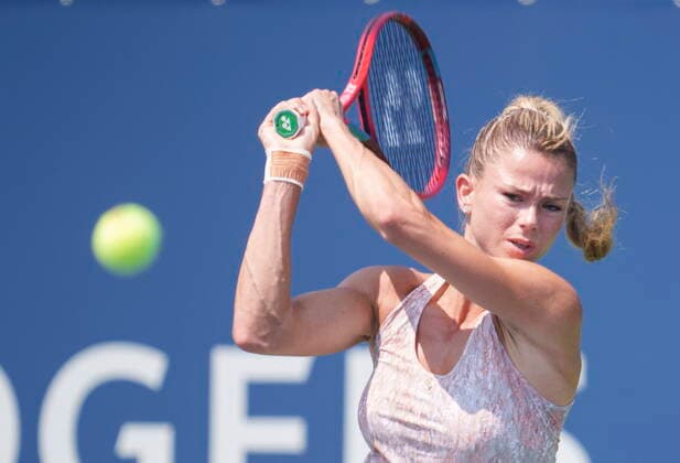August 10, 2021, Montreal, PQ, Canada: Camila Giorgi of Italy returns to Elise Mertens of Belgium during first round of play at the National Bank Open tennis tournament Tuesday August 10, 2021 in Montreal. Camila Giorgi  - ZUMAc35_ 20210810_zaf_c35_044 Copyright: xPaulxChiassonx