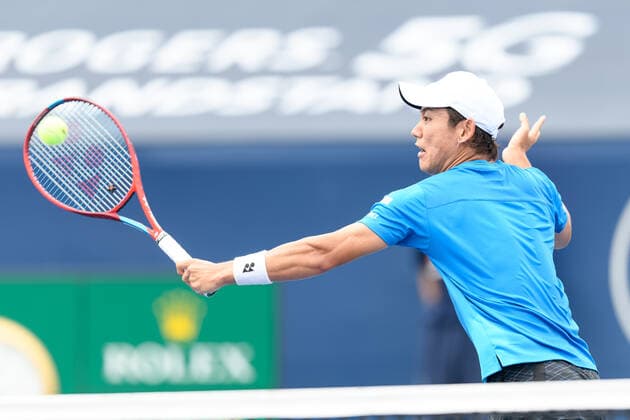 TORONTO, ON - AUGUST 10: Yoshihito Nishioka (JPN) returns the ball during his National Bank Open tennis tournament first round game on August 10, 2021, at Aviva Centre in Toronto, ON, Canada. (Photo by Julian Avram Icon Sportswire) TENNIS: AUG 10 National Bank Open Icon2108100703