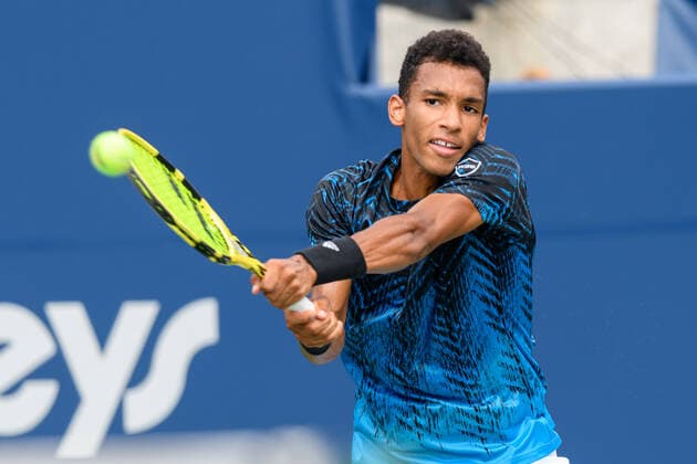 TORONTO, ON - AUGUST 11: Felix Auger-Aliassime (CAN) returns the ball during his National Bank Open tennis tournament second round game on August 11, 2021, at Aviva Centre in Toronto, ON, Canada. (Photo by Julian Avram Icon Sportswire) TENNIS: AUG 11 National Bank Open Icon2108110020