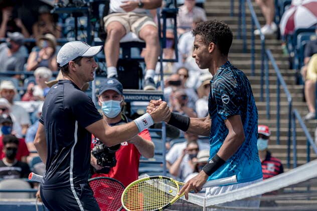 August 11, 2021, Toronto, on, Canada: Canada s Felix Auger-Aliassime congratulates Serbia s Dusan Lajovic after Lajovic defeated Auger-Aliassime in Men s National Bank Open tennis action, in Toronto on Wednesday, Aug., 11, 2021. Canada News - August 11, 2021  - ZUMAc35_ 20210811_zaf_c35_059 Copyright: xChristopherxKatsarovx