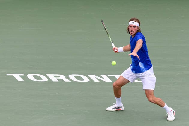 TORONTO, ON - AUGUST 12: Stefanos Tsitsipas (GRE) returns the ball during his National Bank Open tennis tournament third round game on August 12, 2021, at Aviva Centre in Toronto, ON, Canada. (Photo by Julian Avram Icon Sportswire) TENNIS: AUG 12 National Bank Open Icon2108120037