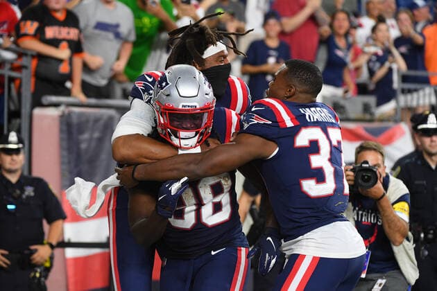 Thursday, August 12, 2021: New England Patriots quarterback Cam Newton (1) and running back Damien Harris (37) pile on defensive back Dee Virgin (38) to celebrate his touchdown during the NFL, American Football Herren, USA preseason game between the Washington Football Team and the New England Patriots held at Gillette Stadium, in Foxborough, Massachusetts. CSM Foxborough USA - ZUMAc04_ 20210812_zaf_c04_070 Copyright: xEricxCanhax