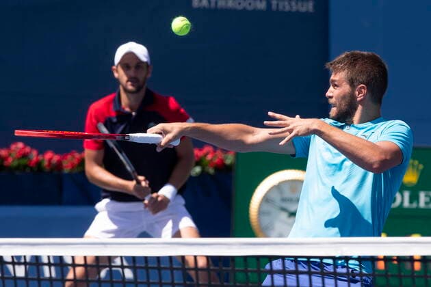 August 14, 2021, Toronto, on, Canada: Croatia s Nikola Mektic, right, and Mate Pavic return during their 7-6 7-6 win against Kevin Krawietz, of Germany, and Horia Tecau, of Romania, in National Bank Open men s tennis action in Toronto, Saturday, Aug. 14, 2021 Niikola Mektic; Mate Pavic.. - ZUMAc35_ 20210814_zaf_c35_014 Copyright: xChrisxYoungx