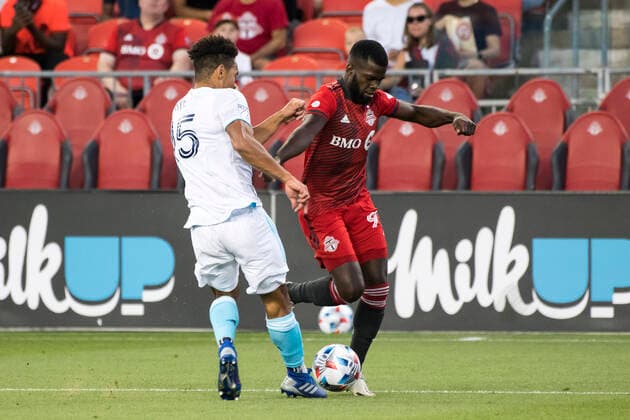 August 14, 2021, Toronto, Ontario, Canada: Kemar Lawrence (92) and Brandon Bye (15) in action during the MLS, Fussball Herren, USA game between between Toronto FC and New England Revolution at BMO field. Toronto Canada - ZUMAs197 20210814_zaa_s197_327 Copyright: xAngelxMarchinix