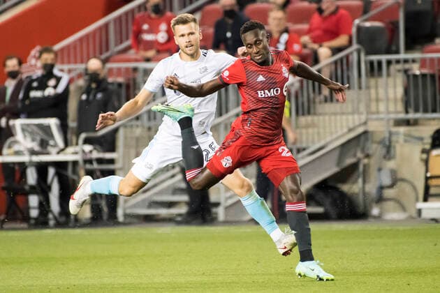 August 14, 2021, Toronto, Ontario, Canada: Richmond Laryea (22) and Arnor Ingvi Traustason (25) in action during the MLS, Fussball Herren, USA game between between Toronto FC and New England Revolution at BMO field. Toronto Canada - ZUMAs197 20210814_zaa_s197_352 Copyright: xAngelxMarchinix