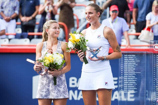 MONTREAL, QC - AUGUST 15: Camila Giorgi (ITA) looks towards Karolina Pliskova (CZE) while holding her winning trophy during the final WTA, Tennis Damen National Bank Open match on August 15, 2021 at IGA Stadium in Montreal, QC (Photo by David Kirouac Icon Sportswire) TENNIS: AUG 15 National Bank Open Icon210815008