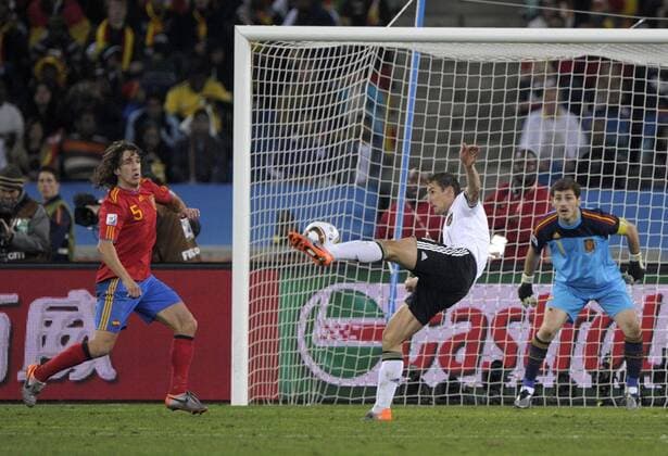 Mandatory Credit: Photo by Back Page Images Shutterstock (1204566v) Miroslav Klose of Germany shoots on goal as Carles Puyol and Spain goalkeeper Iker Casillas watch Germany v Spain, 2010 FIFA World Cup, WM, Weltmeisterschaft, Fussball semi-final football match, Moses Mabhida Stadium, Durban, South Africa - 07 Jul 2010 Spain beat Germany 1-0 EDITORIAL USE ONLY Germany v Spain, 2010 FIFA World Cup semi-final football match, Moses Mabhida Stadium, Durban, South Africa - 07 Jul 2010 EDITORIAL USE ONLY  Copyright: xBackxPagexImages Shutterstockx 1204566v