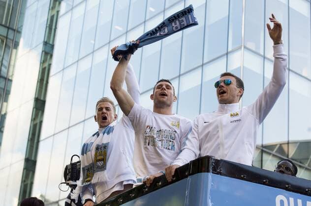 Mandatory Credit: Photo by Paul Greenwood BPI Shutterstock (3744876k) Manchester City s Joe Hart, James Milner and Edin Dzeko celebrate on the bus during the Open Top Bus parade down Deansgate, Manchester Barclays Premier League 2013 14, Manchester City Premier League Trophy Parade, Manchester City Centre (Manchester, GB) - 12 May 2014 EDITORIAL USE ONLY No use with unauthorised audio, video, data, fixture lists (outside the EU), club league logos or live services. Online in-match use limited to 45 images (+15 in extra time). No use to emulate moving images. No use in betting, games or single club league player publications services. Barclays Premier League 2013 14, Manchester City Premier League Trophy Parade, Manchester City Centre (Manchester, GB) - 12 May 2014 EDITORIAL USE ONLY No use with unauthorised audio, video, data, fixture lists (outside the EU), club league logos or live services. Online in-match use limited to 45 images (+15 in extra time). No use to emulate moving images. No use in betting, games or Copyright: xPaulxGreenwood BPI Shutterstockx 3744876k