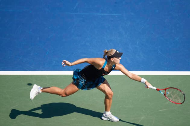CINCINNATI, OH - AUGUST 21: Angelique Kerber of Germany stretches to hit a hits a backhand shot during the semifinal match on day 7 of the Western & Southern Open at the Lindner Family Tennis Center in Mason, Ohio on August 21, 2021. (Photo by Shelley Lipton Icon Sportswire) TENNIS: AUG 21 Western & Southern Open Icon21082109