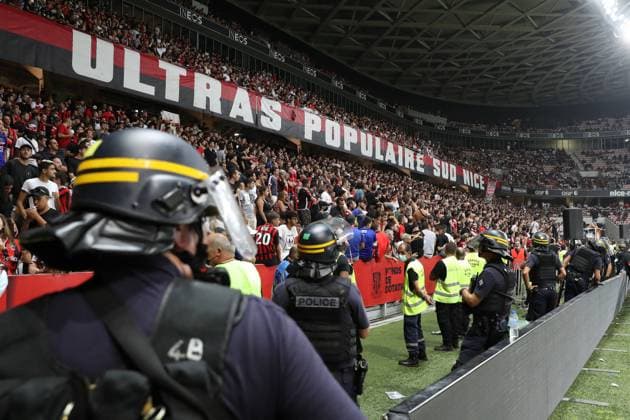 Nice, France, 22nd August 2021. A heavy police presence keeps watch on the OGC Nice fans in the South Curve following the pitch invasion during the Lique 1 match at Allianz Riviera Stadium, Nice. Picture credit should read: Jonathan Moscrop Sportimage EDITORIAL USE ONLY. No use with unauthorised audio, video, data, fixture lists, club league logos or live services. Online in-match use limited to 120 images, no video emulation. No use in betting, games or single club league player publications. SPI-1148-0037