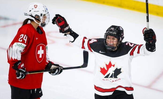 August 24, 2021, Calgary, ab, Canada: Canada s Natalie Spooner, right, celebrates a goal as Switzerland s Noemi Ryhner skates away during third period IIHF Women s World Championship, WM, Weltmeisterschaft hockey action in Calgary, Tuesday, Aug. 24, 2021. Natalie Spooner, Noemi Ryhner - ZUMAc35_ 20210824_zaf_c35_096 Copyright: xJeffxMcintoshx