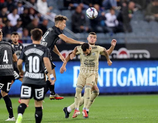 SOCCER - UEFA EL, Sturm vs Mura GRAZ,AUSTRIA,26.AUG.21 - SOCCER - UEFA Europa League play off, SK Sturm Graz vs NS Mura. Image shows Otar Kiteishvili, David Affengruber (Sturm) and Ziga Skoflek (Mura).  GEPAxpictures xHansxOberlaender