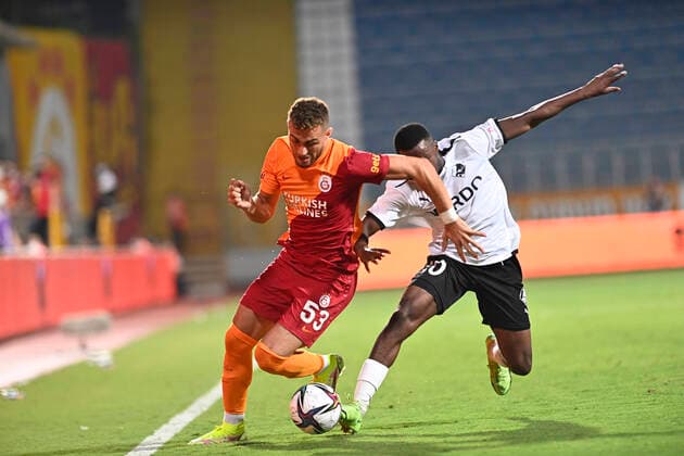 Baris Alper Yilmaz (L) of Galatasaray and Tosin Kehinde (R) of Randers FC during the UEFA Europa League Play off second leg match between Galatasaray and Randers FC at Kasimpasa Recep Tayyip Erdogan Stadium in Istanbul , Turkey on August 26 , 2021. 