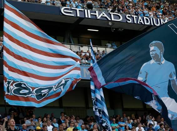 Manchester, England, 28th August 2021. Manchester City fans fly flags before the Premier League match at the Etihad Stadium, Manchester. Picture credit should read: Darren Staples Sportimage EDITORIAL USE ONLY. No use with unauthorised audio, video, data, fixture lists, club league logos or live services. Online in-match use limited to 120 images, no video emulation. No use in betting, games or single club league player publications. SPI-1157-0044