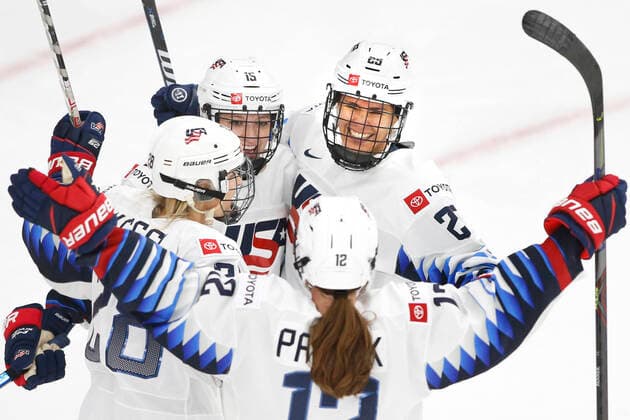 USA player Alex Carpenter, rt, celebrates with teammates her first period goal against Canada during IIHF Women s World Championship, WM, Weltmeisterschaft gold medal play in Calgary, Alberta, Canada on Aug. 31, 2021. digital photo by Larry MacDougal Alex Carpenter