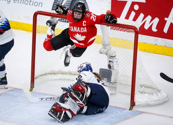 August 31, 2021, Calgary, ab, Canada: Canada s Marie-Philip Poulin, top, hangs from the cross bar after crashing into goalie Nicole Hensley, of the United States, during third period gold medal final IIHF Women s World Championship, WM, Weltmeisterschaft hockey action in Calgary, Tuesday, Aug. 31, 2021. Marie-Philip Poulin, Nicole Hensley,  - ZUMAc35_ 20210831_zaf_c35_089 Copyright: xJeffxMcintoshx