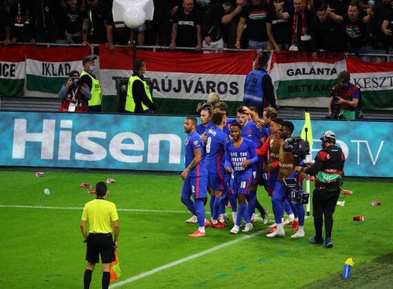 Hungary v England 2022 FIFA World Cup, WM, Weltmeisterschaft, Fussball Qualifiers Raheem Sterling celebrates with his team-mates after opening the scoring for England while cups are thrown at them by Hungary supporters during the 2022 FIFA World Cup Qualifiers match at the Ferenc Puskas Stadium, Budapest Content Not Available For UK Newspapers Copyright: xFocusxImagesx FIL-15839-0027