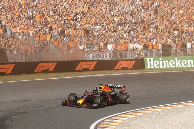 ZANDVOORT- Max Verstappen waves to his fans after winning the Dutch Grand Prix at the Zandvoort circuit. ANP VINCENT JANNINK Grand Prix xVIxANPxSportx xxANPxIVx
