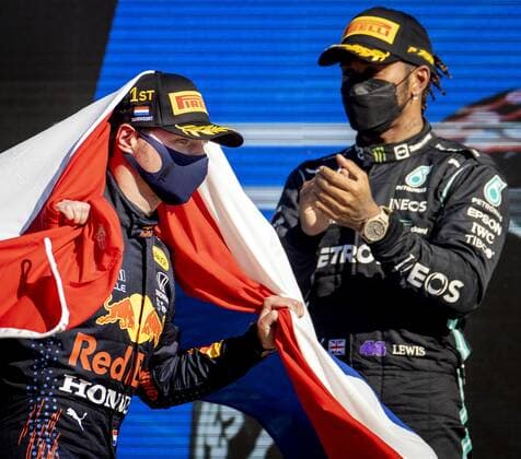 ZANDVOORT - Max Verstappen (Red Bull Racing) celebrates winning the Dutch Grand Prix at the Zandvoort circuit together with Lewis Hamilton (Mercedes). KOEN VAN WEEL Grand Prix xVIxANPxSportx xxANPxIVx