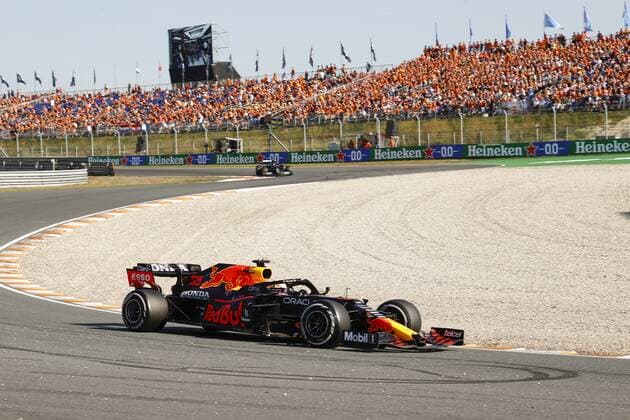 ZANDVOORT- Max Verstappen with Lewis Hamilton behind him during the Dutch Grand Prix at the Zandvoort circuit. ANP VINCENT JANNINK Grand Prix xVIxANPxSportx xxANPxIVx