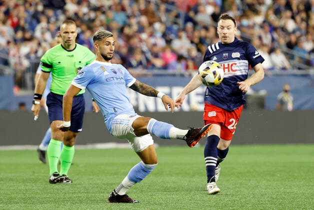 FOXBOROUGH, MA - SEPTEMBER 11: New York City FC forward Valentin Castellanos (11) plays the ball away from New England Revolution midfielder Tommy McNamara (26) during a match between the New England Revolution and New York City FC on September 11, 2021 at Gillette Stadium in Foxborough, Massachusetts. (Photo by Fred Kfoury III Icon Sportswire) SOCCER: SEP 11 MLS, Fussball Herren, USA - New York City FC at New England Revolution Icon482210911011