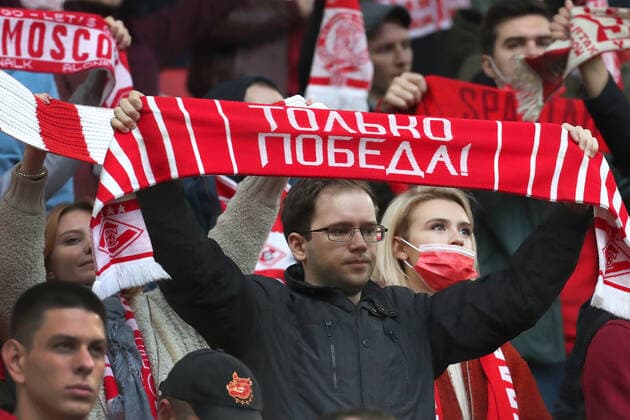MOSCOW, RUSSIA â€“ SEPTEMBER 15, 2021: FC Spartak Moscow s supporters wave flags before their 2021 22 UEFA Europa League Group C football match against FC Legia Warsaw, at Otkrytie Arena Stadium. Sergei Fadeichev TASS  TS11082A