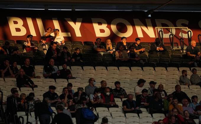 Mandatory Credit: Photo by Jed Leicester Shutterstock (12345727d) West Ham United fans in the evening sunlight in the Billy Bonds stand West Ham United v Leicester City, Premier League, Football, The London Stadium, London, UK - 23 Aug 2021 EDITORIAL USE ONLY No use with unauthorised audio, video, data, fixture lists, club league logos or live services. Online in-match use limited to 120 images, no video emulation. No use in betting, games or single club league player publications. West Ham United v Leicester City, Premier League, Football, The London Stadium, London, UK - 23 Aug 2021 EDITORIAL USE ONLY No use with unauthorised audio, video, data, fixture lists, club league logos or live services. Online in-match use limited to 120 images, no video emulation. No use in betting, games or single club league player publications.  Copyright: xJedxLeicester Shutterstockx 12345727d