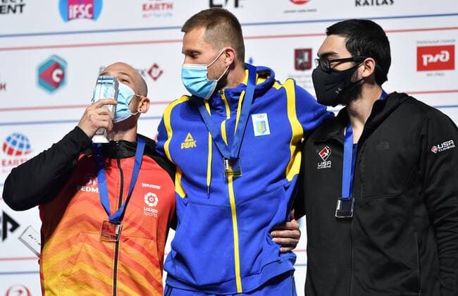 6652617 16.09.2021 From left, silver medalist Spain s Erik Noya Cardona, gold medalist Ukraine s Danyil Boldyrev and bronze medalist Noah Bratschi, of the United States, celebrate on the podium during the awarding ceremony for men s speed competition at Climbing World Championships, in Moscow, Russia. Pavel Bednyakov Sputnik Russia Climbing World Championships Speed  4edcf2ebbeefa2ed
