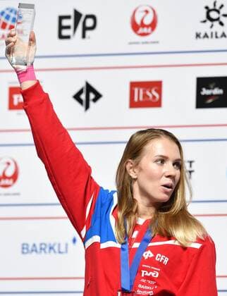 6652630 16.09.2021 Silver medalist Russia s Iuliia Kaplina celebrates on the podium during the awarding ceremony for the women s speed competition at Climbing World Championships, in Moscow, Russia. Pavel Bednyakov Sputnik Russia Climbing World Championships Speed  83433067fada8953