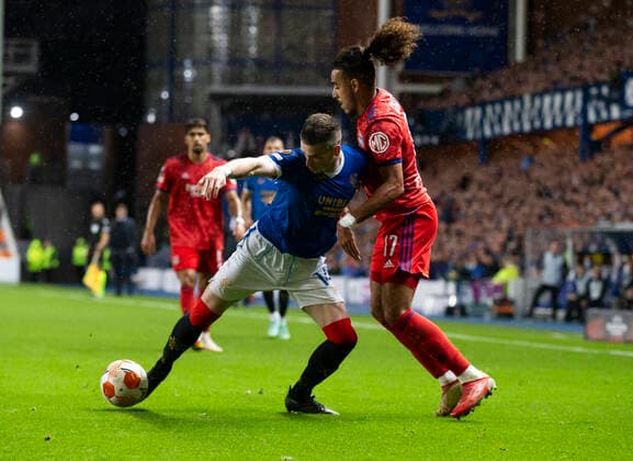 Football - 2021 2022 UEFA Europa League - Group A, Round One - Glasgow Rangers vs Lyon - Ibrox stadium - Thursday 16th September 2021 Ryan Kent of Rangers vies with Malo Gusto of Olympique Lyonnais 