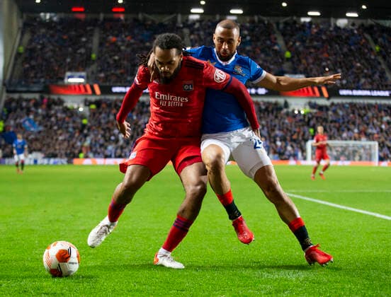 Football - 2021 2022 UEFA Europa League - Group A, Round One - Glasgow Rangers vs Lyon - Ibrox stadium - Thursday 16th September 2021 Kemar Roofe of Rangers vies with Jason Denayer of Olympique Lyonnais 
