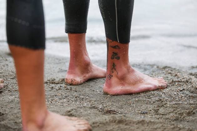 TRIATHLON - Ironman Austria KLAGENFURT,AUSTRIA,19.SEP.21 - TRIATHLON, RUNNING - Ironman Austria. Image shows a tattoo.  GEPAxpictures xDanielxGoetzhaber
