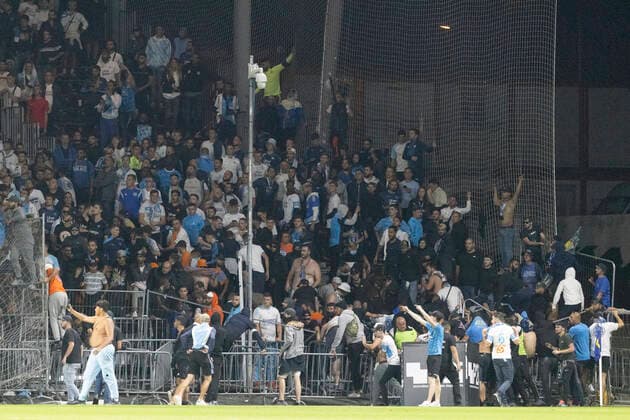 Marseille s supporters invade the field after the French L1 football match between Angers (ASCO) and Marseille (OM), at Raymond-Kopa stadium in Angers, on September 22, 2021.  Copyright: xJeremiasxGonzalezx