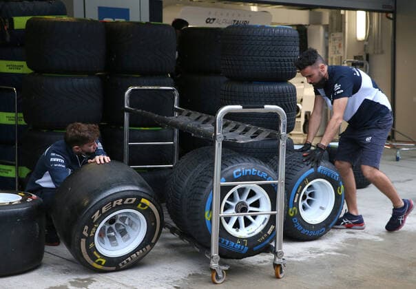 SOCHI, RUSSIA - SEPTEMBER 23, 2021: A car mechanic moves tires during preparations for the 2021 Formula One Russian Grand Prix to be held in Sochi on September 24-26, 2021, at the Sochi Autodrom racing circuit. Sergei Fadeichev TASS  TS111979