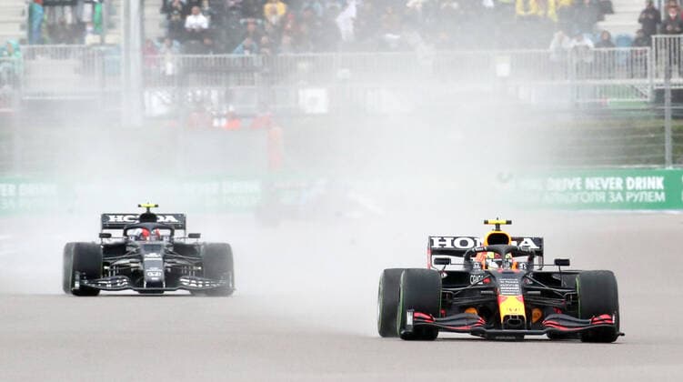 SOCHI, RUSSIA â€“ SEPTEMBER 25, 2021: Red Bull Racing F1 Team driver Sergio Perez (L) of Mexico and Scuderia AlphaTauri F1 Team driver Pierre Gasly of France compete in a qualifying session for the 2021 Formula One Russian Grand Prix, at the Sochi Autodrom racing circuit. Sergei Fadeichev TASS  TS111EB4