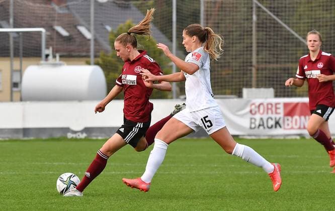 26.09.2021 - Fussball - Saison 2021 2022 - DFB Pokal Vereinspokal der Frauen - 02. Runde: 1. FC Nürnberg Nuernberg FCN ( Club ) - Eintracht Frankfurt SGE - Sportfoto Zink MeZi - regulations prohibit any use of photographs as image sequences and or quasi-video - Nadja Burkard (22, 1. FC Nürnberg FCN, links ) Sandrine Mauron (15, Eintracht Frankfurt )