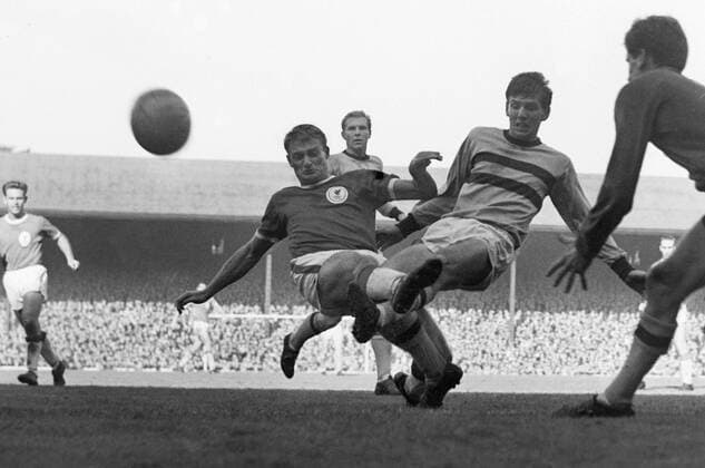 Football - 1963 1964 First Division - Liverpool 1 West Ham United 2 Liverpool s Roger Hunt and West Ham s Martin Peters and Jim Standen clash at Anfield with Bobby Moore in the background. It was to be 52 years before West Ham won at Liverpool again. 
