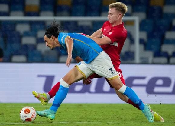 6663042 30.09.2021 Napoli s Eljif Elmas, at the foreground, and Spartak s Nail Umyarov struggle for a ball during the Europa League soccer match between Napoli and Spartak Moscow, at Diego Armando Maradona stadium, in Naples, Italy. Alexander Vilf Sputnik Italy Soccer Europa League Napoli - Spartak  9c9e03bf01c63cc0