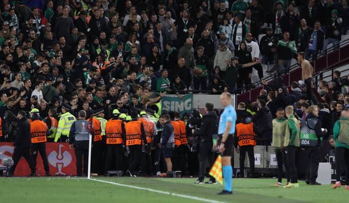 London, England, 30th September 2021. Police and stewards intervene between two sets of fans following the goal during the UEFA Europa League match at the London Stadium, London. Picture credit should read: Paul Terry Sportimage EDITORIAL USE ONLY. No use with unauthorised audio, video, data, fixture lists, club league logos or live services. Online in-match use limited to 120 images, no video emulation. No use in betting, games or single club league player publications. SPI-1221-0029