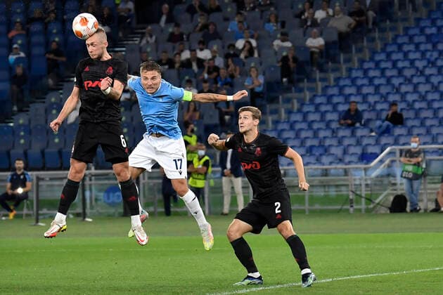 Italy: S.S. Lazio vs Lokomotiv Moskva 2-0 Dmitri Barinov of Lokomotiv Moskva and Ciro Immobile of SS LAZIO in action during the UEFA Europa League group E match between Lazio Roma Lokomotiv Moskva at Stadio Olimpico on September 30, 2021 in Rome, Italy. Rome Italy Copyright: DomenicoxCippitelli