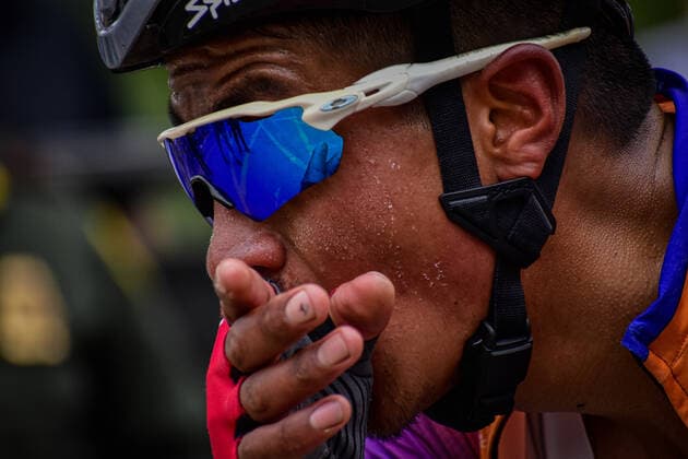 September 30, 2021, Buesaco, NarioÂ±o, Colombia: First stage of the Vuelta a NarioÂ±o competition between the municipalities of La Cruz and Buesaco. As a member of the team Saitel reaching to the goal while is wiping his sweat in Buesaco, NarioÂ±o - Colombia on September 30, 2021 Buesaco Colombia - ZUMAvp1_ 0136575011st Copyright: xCamiloxErassox
