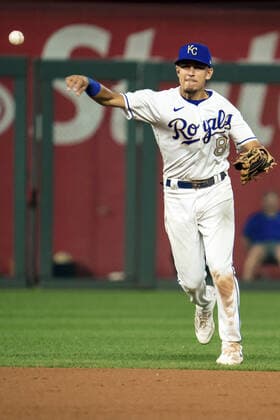 Kansas City Royals second baseman Nicky Lopez (8) attempts to throw the Minnesota Twins runner out at first in the seventh inning at Kaufman Stadium in Kansas City, Missouri on Friday, October 1, 2021.  KCP20211001123 KYLExRIVAS