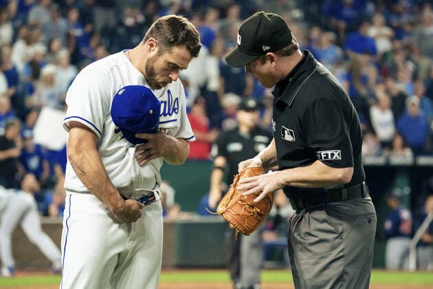 Kansas City Royals relief pitcher Greg Holland (35) has his belt checked by an umpire after pitching against the Minnesota Twins in the seventh inning at Kaufman Stadium in Kansas City, Missouri on Friday, October 1, 2021.  KCP20211001124 KYLExRIVAS
