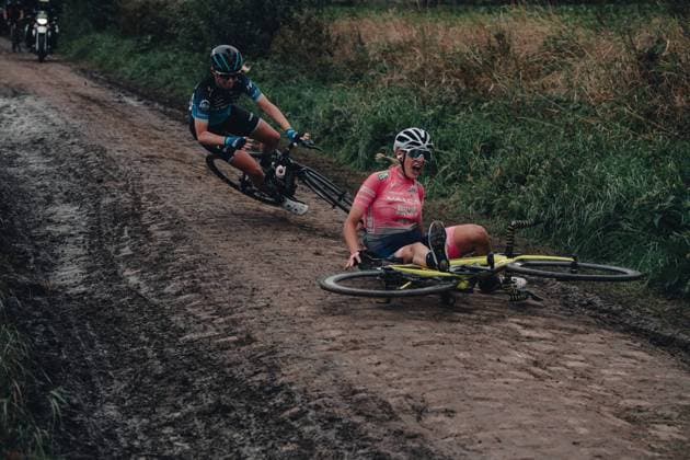 Sport Bilder des Tages 2nd October 2021, Paris& x2013;Roubaix Cycling tour; The first ever women& x2019;s edition of Paris Roubaix which is famous for its uneven cobblestone course. A competitor slips and start to go down on the cobbles bringing down the rider immediately behind  ActionPlus12328071 SimonxGill