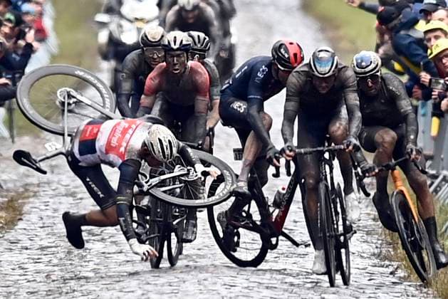 ROUBAIX, FRANCE - OCTOBER 03 : Crash at TrouÃ e d Arenberg pictured during the UCI World Tour 118th Paris Roubaix cycling race with start in Compiegne and finish at the Velodrome Andre-Petrieux in Roubaix on October 03, 2021 in Roubaix, France, 03 10 2021 ( Motordriver Kenny Verfaillie - Paris Roubaix 2021 UCI World Tour Cycling Race PhotoNews Panoramic 