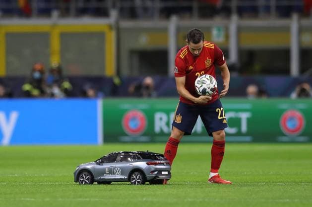 Milan, Italy, 5th October 2021. The match ball is delivered to Pablo Sarabia of Spain on a remote controlled model Volkswagen car prior to kick off in the UEFA Nations League match at Giuseppe Meazza, Milan. Picture credit should read: Jonathan Moscrop Sportimage EDITORIAL USE ONLY. No use with unauthorised audio, video, data, fixture lists, club league logos or live services. Online in-match use limited to 120 images, no video emulation. No use in betting, games or single club league player publications. SPI-1229-0003